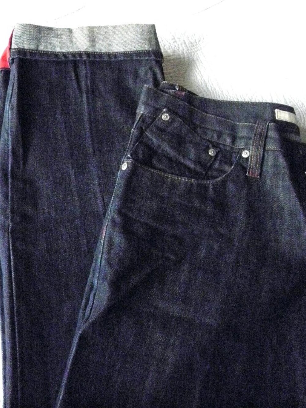 DKNY, 32'' WAIST AND 34'' INSEAM, BLUE WITH THE RED BOTTOM DETAILS.